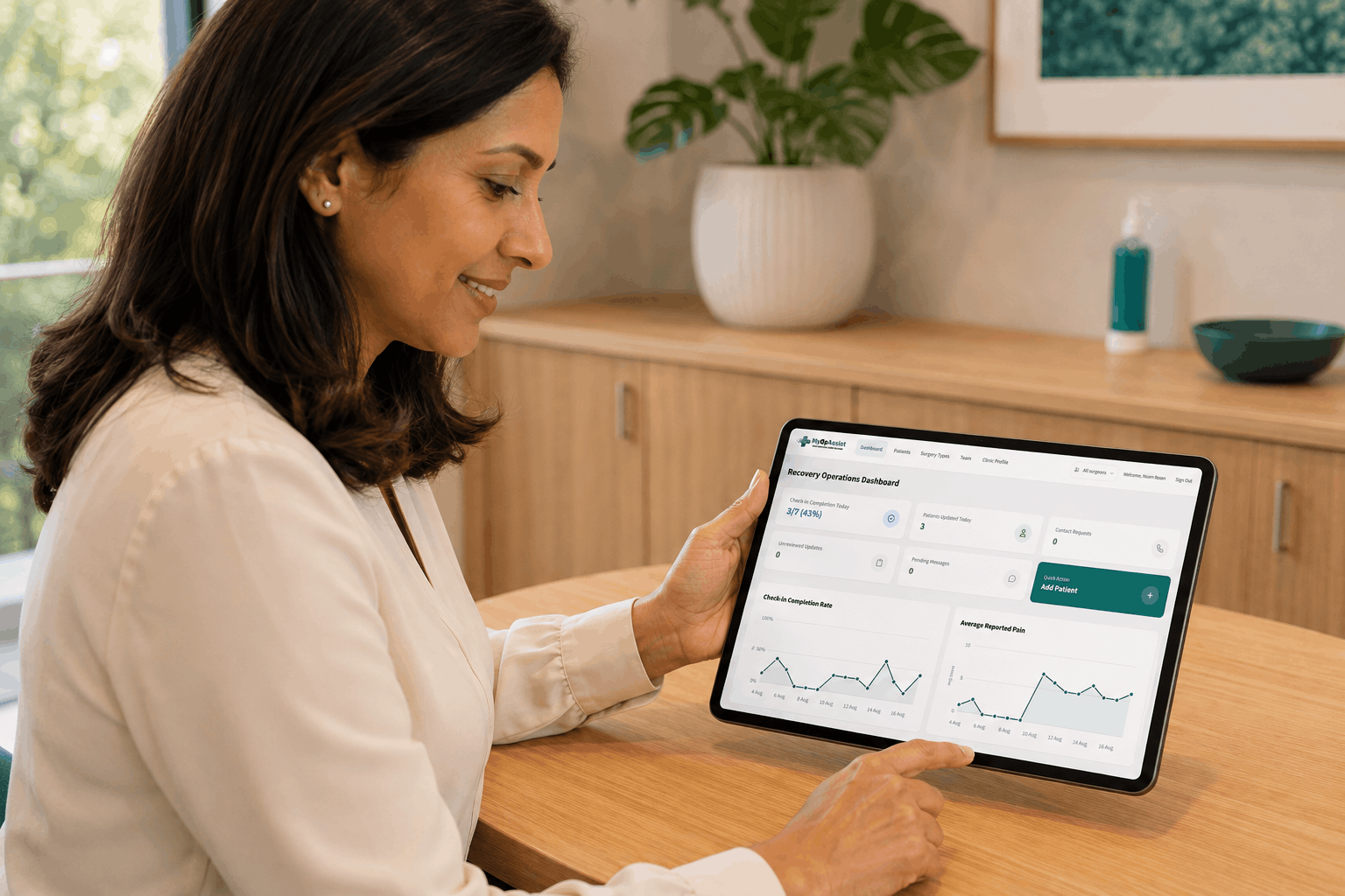 A clinician reviewing the MyOpAssist recovery dashboard on a tablet